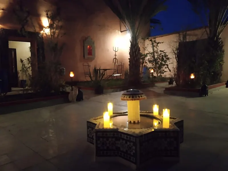 Candles on the courtyard fountain at night
