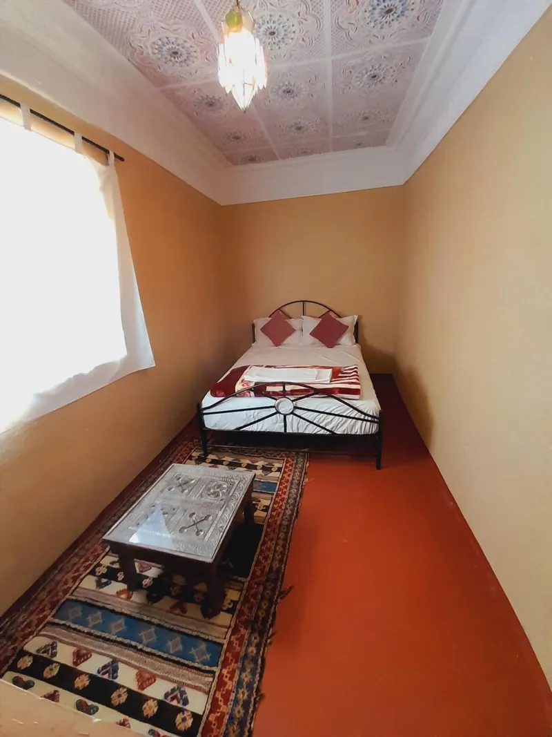 Double or Twin Room: the bed and a small table