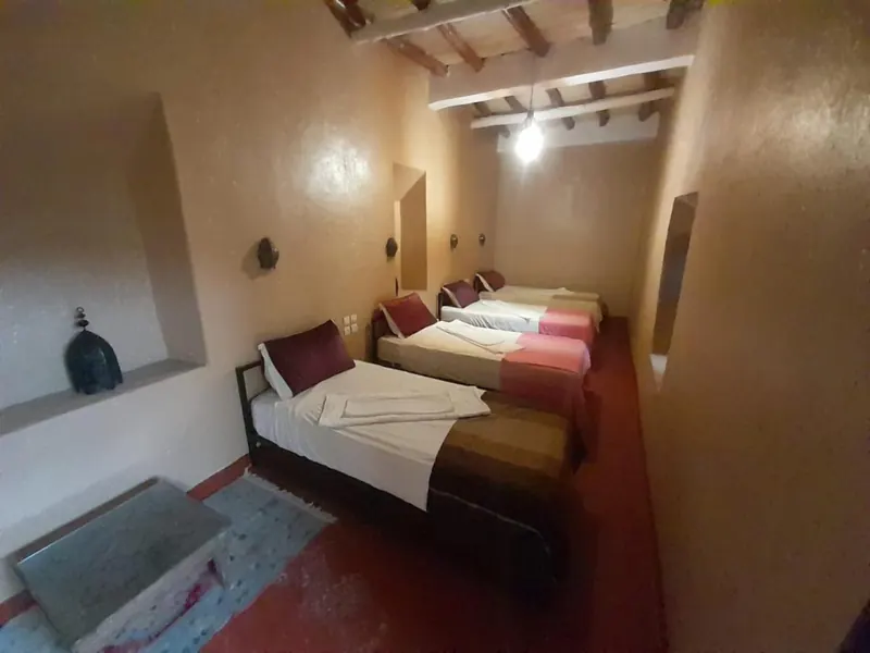 Quadruple Room: the four single beds along the wall
